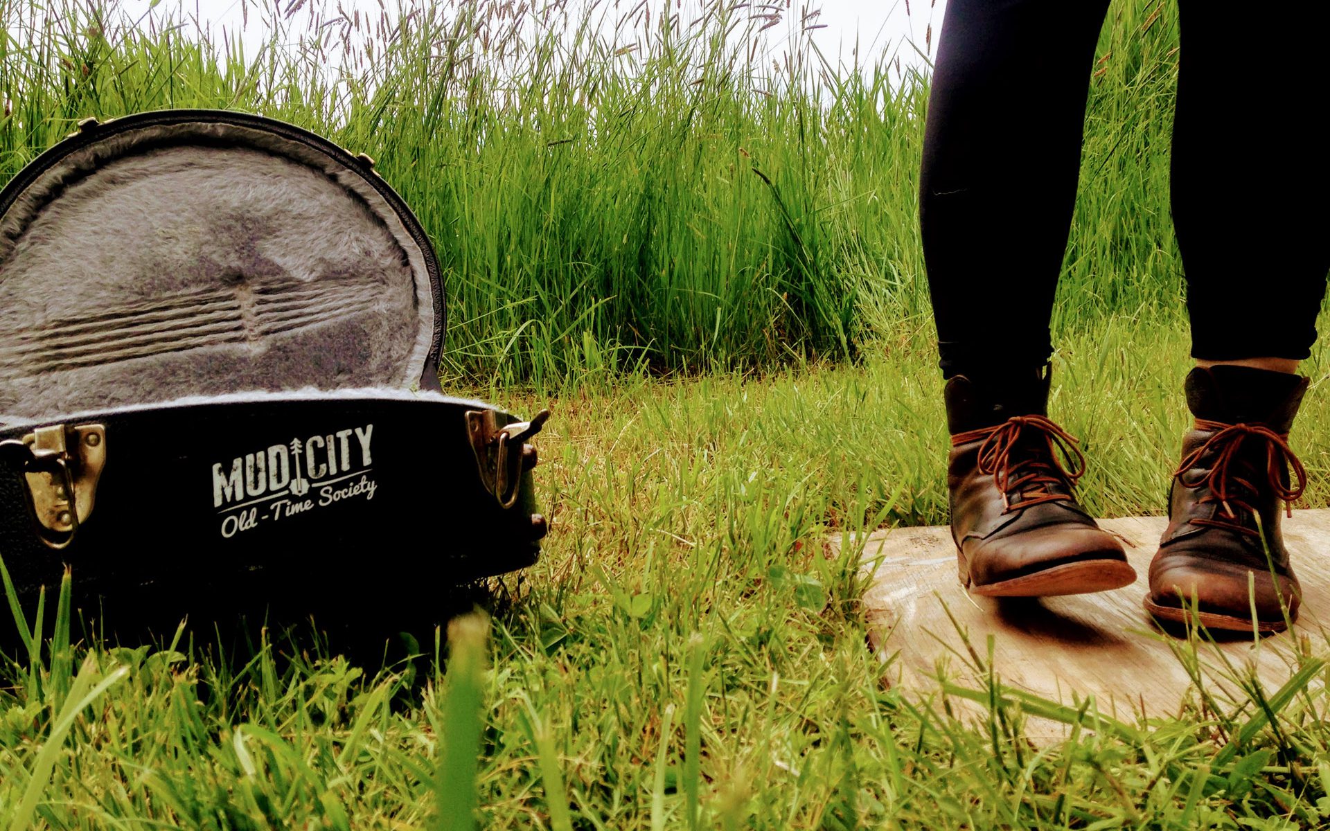 Flatfoot dancing next to banjo case